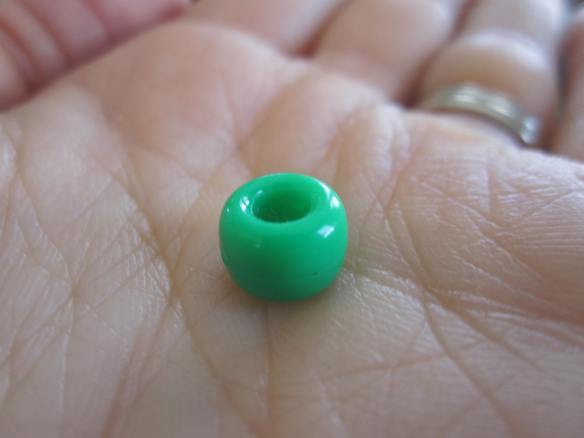 Exhibit A: A shiny round pony bead.  Perfect for making into necklaces, bracelets, and ideally sized for a preschooler's nose.
